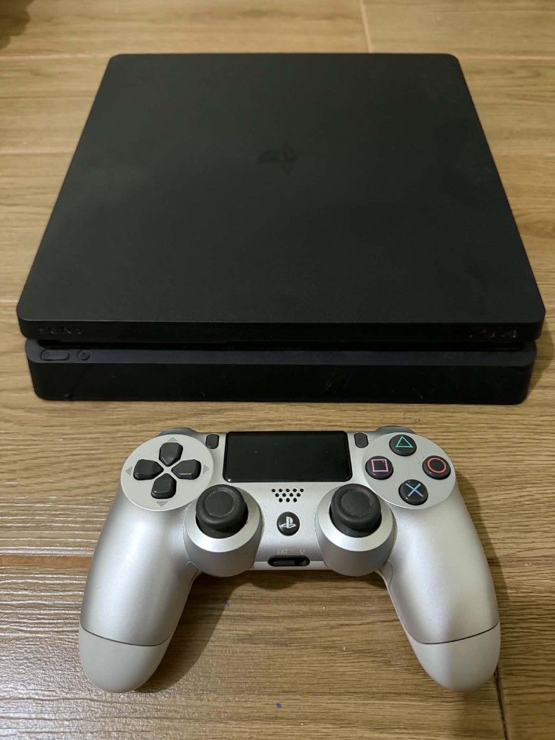 Sony PlayStation 4 Slim Console with Silver Controller (Category: PlayStation) located in Manila. Submitted by jcmontillar (Listing ID 1460453371, Image 1). Description: - Black PlayStation 4 Slim Console - Silver DualShock 4 Controller - Controller works well - Ready for gaming - Includes power cable.