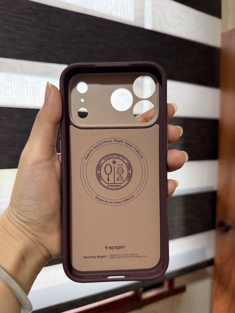 Spigen Nano Pop Ip 17 promax case (Category: Cases & Sleeves) located in Cavite. Submitted by str4wb3ryyy___ (Listing ID 1460389200, Image 3). Description: FS! Spigen Nano Pop Ip 17 Pro Max Case (Burgundy Bean) ‼️₱999‼️ - in good condition, but there is a white to almost transparent stain when i got the case from spigen online store - has light scratches but barely visible -magsafe!! - pretty color! Has a rough grip on the side RFS- decluttering,