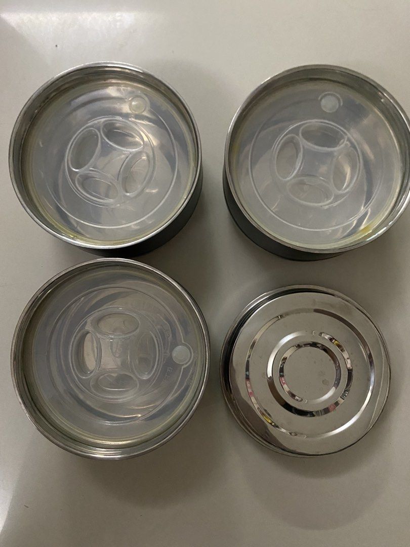 Stackable Stainless Steel Lunch Box with Lids (Category: Food Organization & Storage) located in Imus. Submitted by 9teen.87 (Listing ID 1460442085, Image 2). Description: - Multi-tier Stackable insulated lunch box - Durable stainless steel containers - Clear plastic lids with secure seals - Stylish matte grey with silver bands - Ideal for packing meals on the go - Easy to clean and convenient to store - Perfect for work or school lunches.