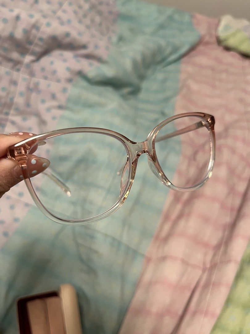 Starfinder Pink Clear Frame Glasses (Category: Sunglasses & Eyewear) located in Las Pinas. Submitted by thevallerys (Listing ID 1460502513, Image 2). Description: - Clear frame with a subtle pink tint - Graded lenses - Comes with case - Super minor flaw shown on last photo on the right side (gap), but does not affect wear at all since it isn’t halata when worn.