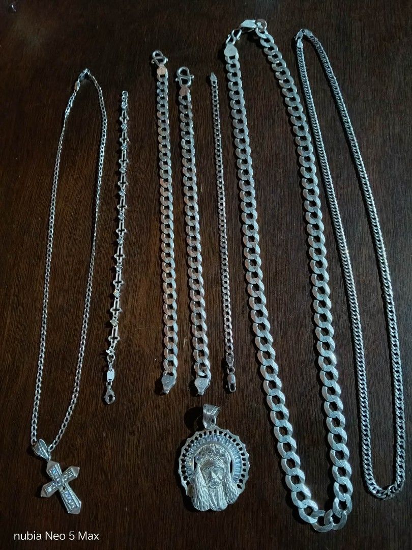 Sterling Silver Chains, Bracelets, and Pendants (Category: Necklaces) located in Cebu City. Submitted by nevernamed17243 (Listing ID 1460439721, Image 2). Description: Selling my collection of silver jewelry. Includes several chains of varying thickness and length, two bracelets, and two pendants. One pendant is a cross, the other features a religious figure. All pieces are made of silver 925. Great for layering or wearing individually. for take 