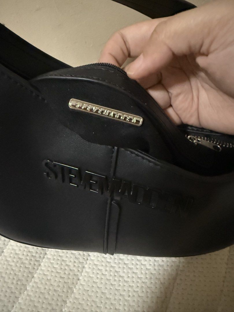 Steve Madden Saddle Bag (Category: Shoulder Bags) located in Quezon City. Submitted by keyavien (Listing ID 1460495657, Image 3). Description: Steve Madden Structured Saddle Bag color: Black zipper closure RFS: Decluttering Book your own lalamove/grab.