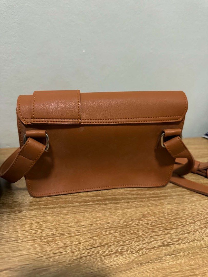 STRAIGHT FORWARD DVL Novia bag (Category: Cross-body Bags) located in Manila. Submitted by jjamcotton (Listing ID 1460489084, Image 2). Description: - Cute brown crossbody bag - Made of durable faux leather - Features a stylish flap closure with buckle detail - Adjustable strap for comfortable wear.