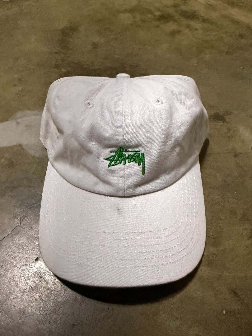 Stussy Cap White Cotton OSFM (Category: Caps & Hats) located in Manila. Submitted by thriftyboyzzz (Listing ID 1460468210, Image 1). Description: - Classic white Stussy dad cap - Embroidered green Stussy logo on front - Made from 100% cotton - Adjustable strap for a comfortable fit - Ideal for everyday casual wear.