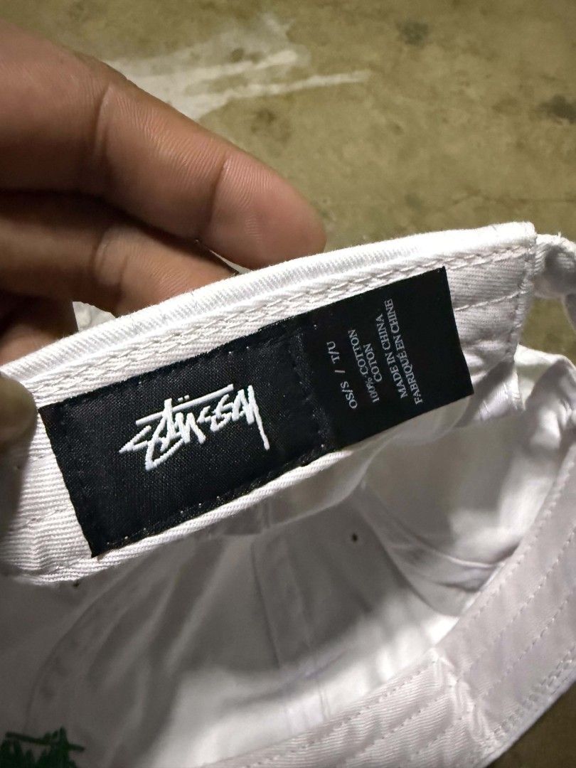 Stussy Cap White Cotton OSFM (Category: Caps & Hats) located in Manila. Submitted by thriftyboyzzz (Listing ID 1460468210, Image 3). Description: - Classic white Stussy dad cap - Embroidered green Stussy logo on front - Made from 100% cotton - Adjustable strap for a comfortable fit - Ideal for everyday casual wear.