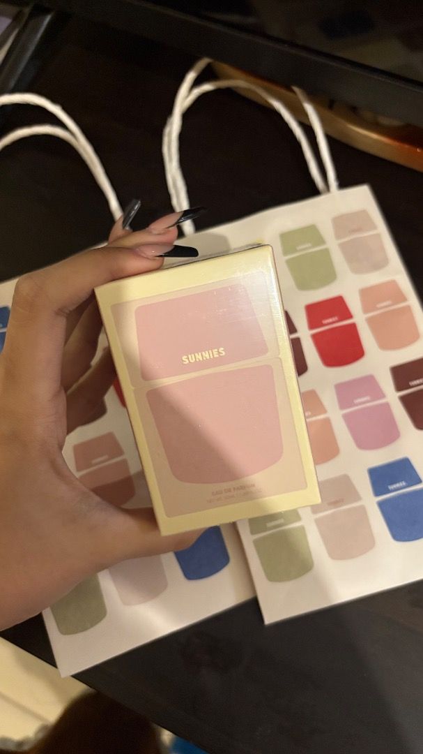 Sunnies Eau de Parfum - Pink Unsealed (Category: Fragrance & Deodorants) located in Taguig. Submitted by imeverywhereimsellahhhh (Listing ID 1460479050, Image 1). Description: - Sunnies Eau de Parfum - Comes in a cute pink and yellow box - Includes two paper bags with Sunnies logo - Sheet of star stickers included - Ideal for gifting or personal use.