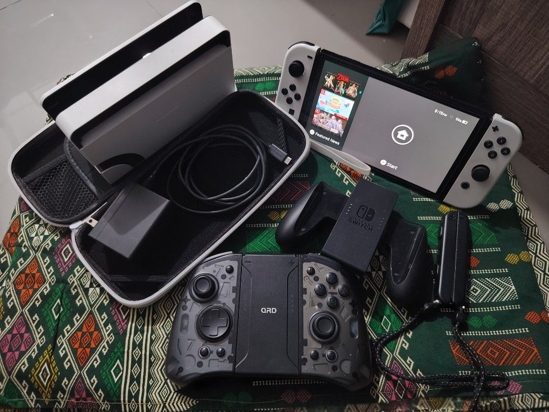 SWITCH OLED (Category: Other Gadgets) located in Caloocan City. Submitted by dwuudwaniel (Listing ID 1460414674, Image 1). Description: Switch OLED white w/ Accessories INCLUSION : 256 gb Team Group Go SD CARD QRD Stellar T5 (Hall effect Joysticks) worth 2k Naka tempered Glass narin Physical Game: Monster Hunter Generation Ultimate w/o box Virtual Game: NBA 2K20 Animal Crossing Warframe Super arcade soccer Bastion Diablo Eternal Collection Guilty