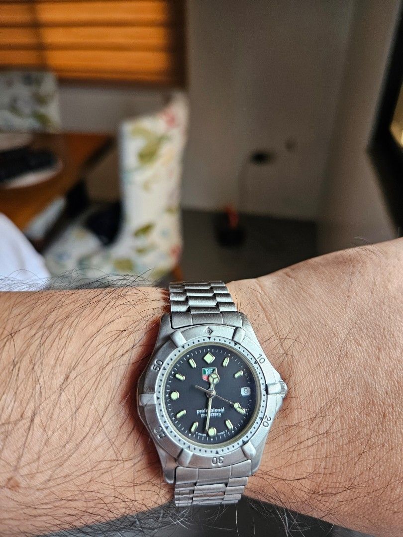 TAG Heuer Professional 200m Watch (Category: Luxury Watches) located in Angeles City. Submitted by eyaryam (Listing ID 1460407414, Image 2). Description: TAG Heuer Professional 2000 watch. Stainless steel band and case. Black dial with date window. Water resistant 200 meters. Classic timepiece for everyday wear. Clasp is secure and functions well. Shows some signs of minimal wear consistent with age..