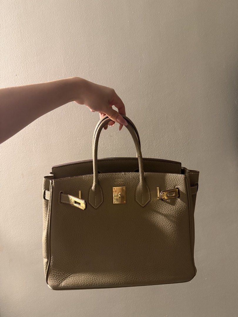 Taupe Bag (Category: Purses & Pouches) located in Makati City. Submitted by florencedoll (Listing ID 1460500420, Image 1). Description: Overall bag is sturdy and structured strong, only defects are there are faded patches, but only a few. Still a pretty and elegant choice.