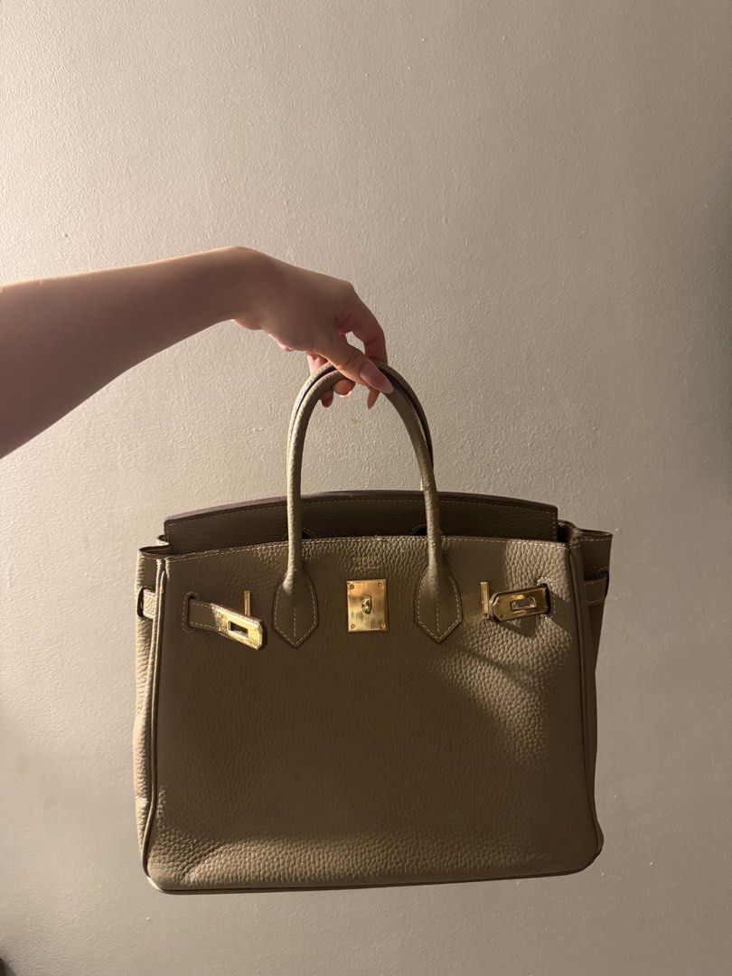 Taupe Bag (Category: Purses & Pouches) located in Makati City. Submitted by florencedoll (Listing ID 1460500420, Image 2). Description: Overall bag is sturdy and structured strong, only defects are there are faded patches, but only a few. Still a pretty and elegant choice.