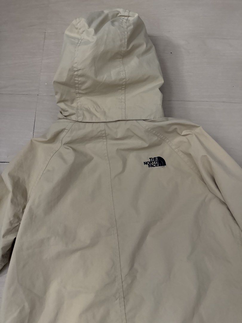 The North Face Jacket Windbreaker (Category: Coats, Jackets and Outerwear) located in Manila. Submitted by juhjuh (Listing ID 1460452763, Image 3). Description: - Beige hooded jacket from The North Face - Two front pockets with button closure - Full zip and button closure at the front - Attached hood - Ideal for rainy days or as a light layer - Simple and classic design.