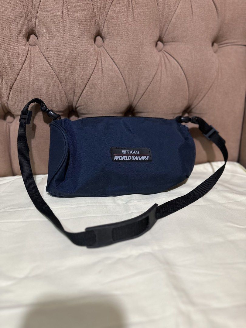 Tiger Bottle Holder Nylon Sling Bag (Category: Food Organization & Storage) located in Davao. Submitted by favoritepreloved (Listing ID 1460437084, Image 1). Description: 💜 25cm height x 11cm x 12cm.