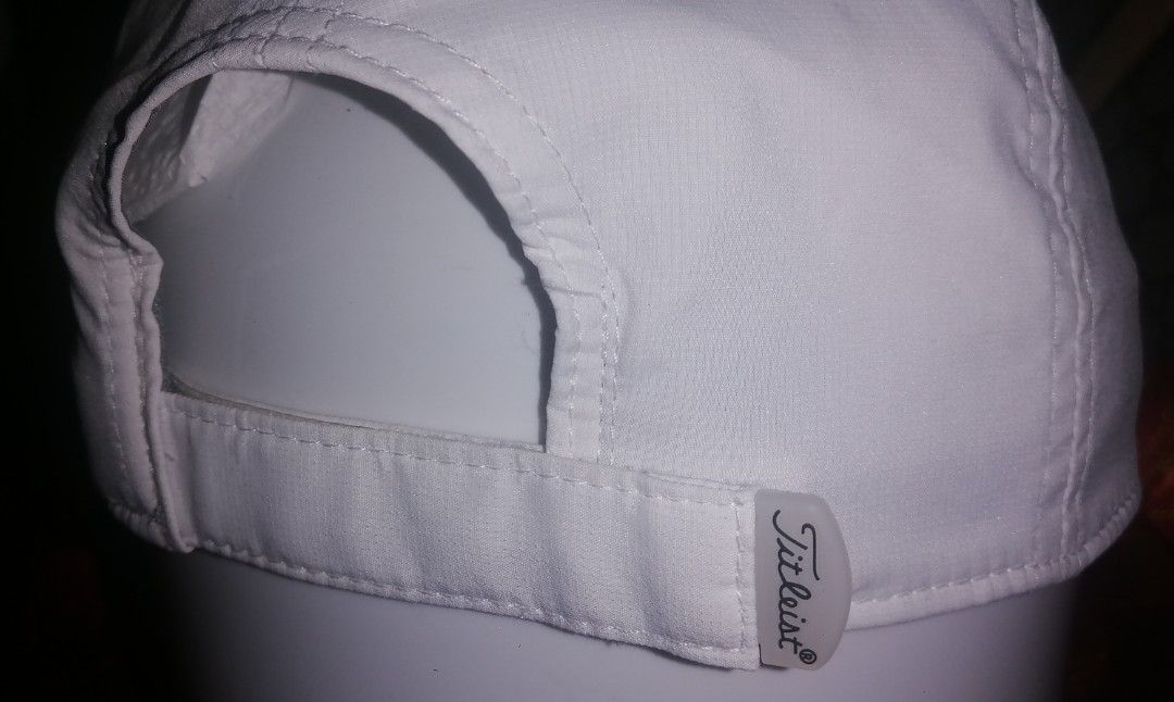 Titleist Golf Cap White (Category: Caps & Hats) located in Quezon City. Submitted by rolenalma (Listing ID 1460418791, Image 2). Description: - Classic white Titleist golf cap - Embroidered logo on the front - Adjustable strap for a comfortable fit - Breathable material - One size fits most - Perfect for sunny days on the golf course or casual outings.
