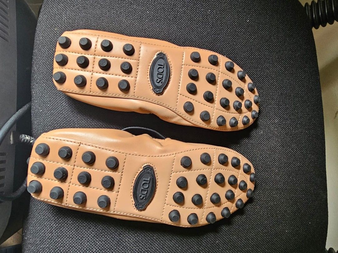 Tod's Gommino Ballet Flats with Ankle Straps (Category: Flats & Sandals) located in Makati City. Submitted by pat1001 (Listing ID 1460311800, Image 2). Description: - Brand: Tod's - Style: Ballet Flats - Color: Nude/Tan - Features: Signature gommino rubber sole - Included: Detachable black leather ankle straps with gold buckles - Comfort: Super comfortable - Versatility: Stylish, great for dressing up or down.