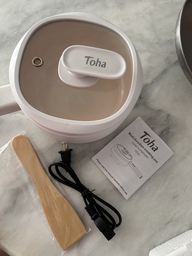 Toha Multi-function Cooking Pot TF01 with Accessories (Category: Cookware & Accessories) located in Manila. Submitted by alisondzi (Listing ID 1460472695, Image 1). Description: ✅ White Toha Multi-Function Cooking Pot (Model TF01) Includes: Pot, Lid, Wooden Spatula, Power Cord, User Manual ✅ Ideal for small kitchens and dorm rooms ✅ Easy to operate and maintain ✅ Simple to clean Never been used, opened for photos only. Selling it because this was