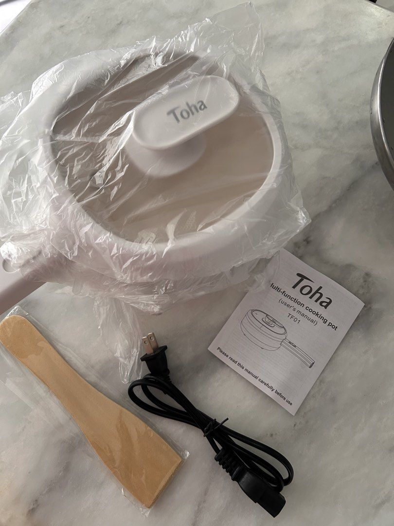 Toha Multi-function Cooking Pot TF01 with Accessories (Category: Cookware & Accessories) located in Manila. Submitted by alisondzi (Listing ID 1460472695, Image 3). Description: ✅ White Toha Multi-Function Cooking Pot (Model TF01) Includes: Pot, Lid, Wooden Spatula, Power Cord, User Manual ✅ Ideal for small kitchens and dorm rooms ✅ Easy to operate and maintain ✅ Simple to clean Never been used, opened for photos only. Selling it because this was