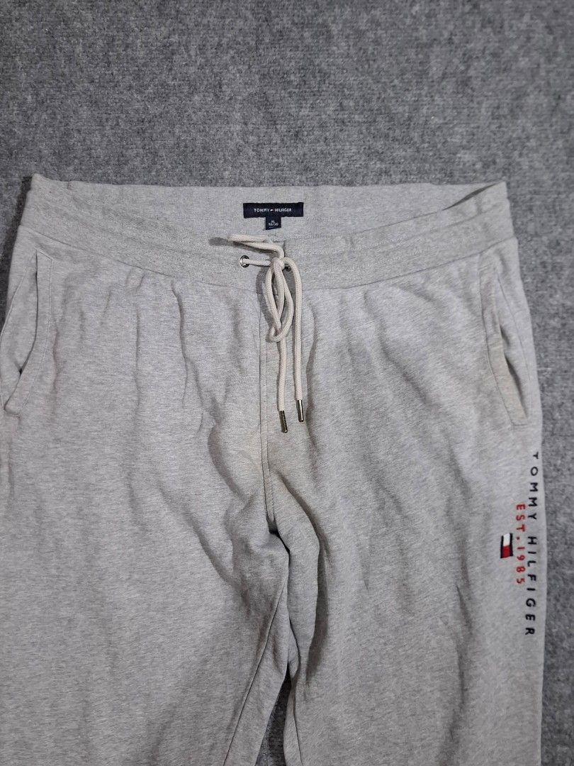Tommy Hilfiger Grey Sweatpants (Category: Activewear) located in Las Pinas. Submitted by nevergetsold.ph (Listing ID 1460334746, Image 3). Description: Tommy Hilfiger Grey Sweatpants Dimentions (inches) Waist: 30-40 Length: 41 Thigh: 15 Leg Opening: 6.5 Issues: none.