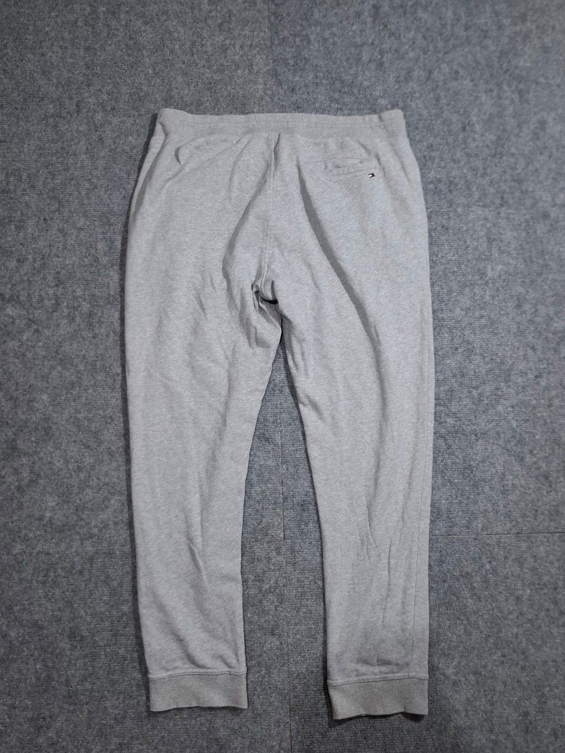 Tommy Hilfiger Grey Sweatpants (Category: Activewear) located in Las Pinas. Submitted by nevergetsold.ph (Listing ID 1460334746, Image 2). Description: Tommy Hilfiger Grey Sweatpants Dimentions (inches) Waist: 30-40 Length: 41 Thigh: 15 Leg Opening: 6.5 Issues: none.