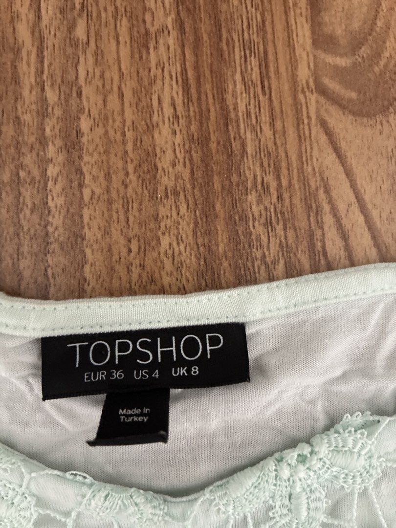 Topshop Lace Top Mint Green (Category: Sleeveless) located in Pasig City. Submitted by slr1949 (Listing ID 1460321651, Image 2). Description: - Mint green lace top from Topshop - Features long sleeves with a delicate floral lace pattern - Scalloped hem detail for a feminine touch - Perfect for layering or wearing solo - Easily dressed up or down for any occasion.