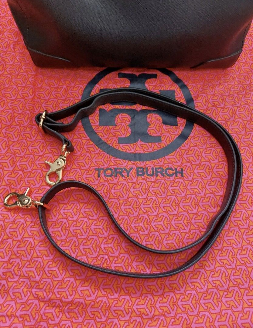 Authentic Tory Burch Doctor / Speedy Bag (Category: Cross-body Bags) located in Manila. Submitted by choy.mayuga (Listing ID 1460345797, Image 2). Description: A Tory Burch doctor bag is a structured, vintage-inspired handbag featuring a wide-opening frame, tubular top handles, and secure zip or lock closures. Design: A ladylike, classic doctor bag silhouette with a structured rectangular shape. Material: Crafted from pebbled leather, smooth leat