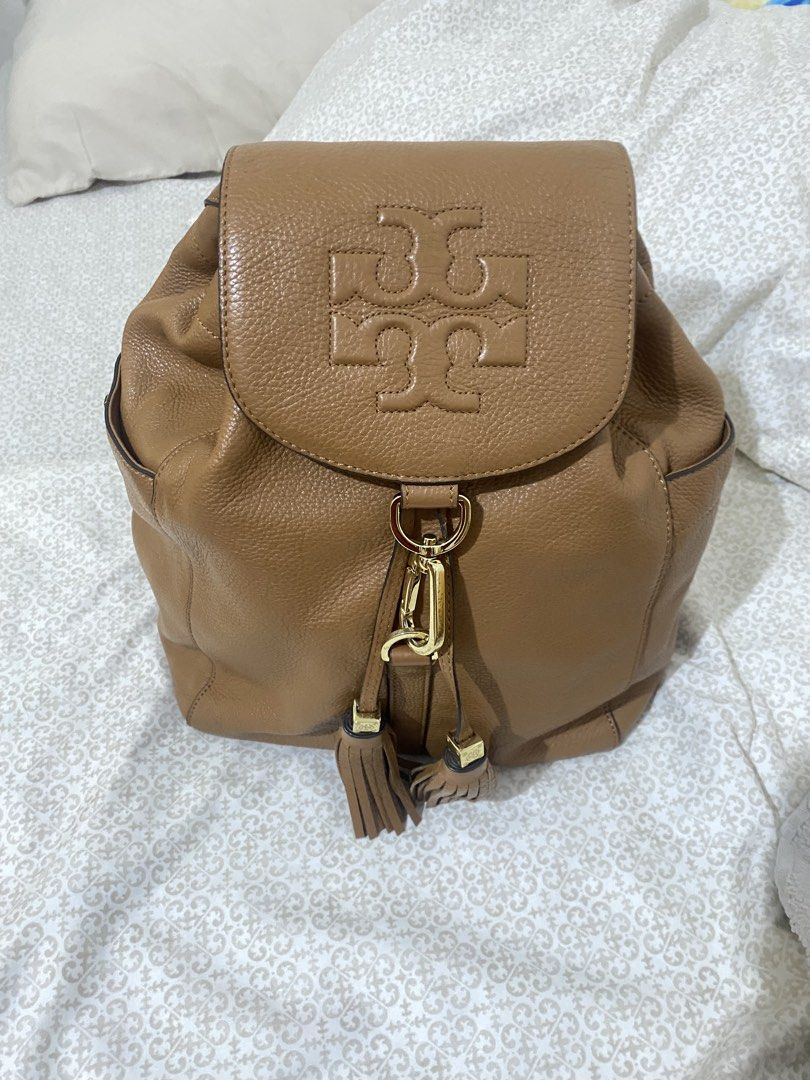 Tory Burch Brown Leather Backpack with Tassel (Category: Backpacks) located in Quezon City. Submitted by irldn_ (Listing ID 1460442153, Image 1). Description: 📩DM for price Rfs: i don't use it anymore - Proof of authenticity in the last photo - It was a gift for me from my auntie when we were in the States - Genuine brown leather Tory Burch backpack - Secure drawstring closure with a stylish flap top - Elegant gold hardware accents, including de