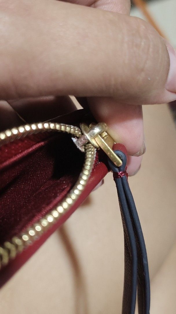 Tory Burch Red Quilted Leather Pouch (Category: Purses & Pouches) located in Antipolo. Submitted by robannrave98496 (Listing ID 1460355490, Image 3). Description: - Tory Burch red quilted leather pouch - Gold zipper closure - Interior card slots - Small wrist strap attached - Ideal for organizing essentials or as a clutch.