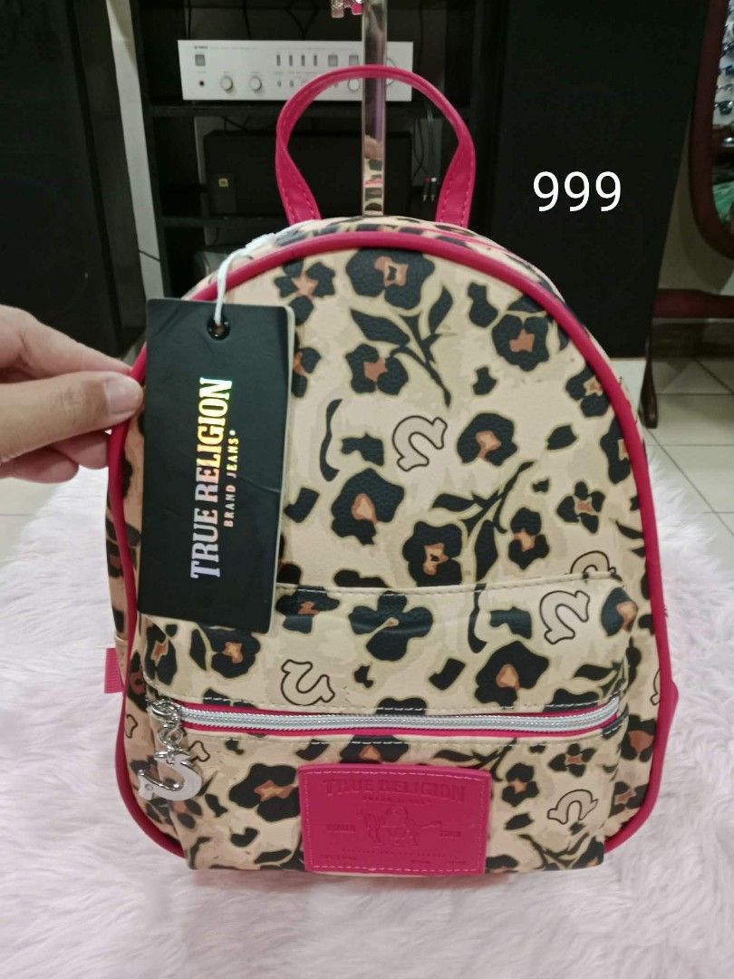 True Religion Leopard Print Mini Backpack (Category: Backpacks) located in Pasig City. Submitted by janalopez904 (Listing ID 1460506143, Image 1). Description: Cute True Religion mini backpack. Features a fun leopard print with pink trim. Has the True Religion logo charm. Great for carrying essentials. Comes with original tag. ASSORTED BAGS 999 PER EACH.