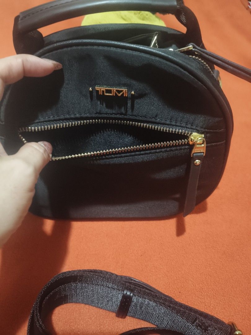 Tumi Mini 3 Way Hand/Sling/Body Bag (Category: Cross-body Bags) located in Quezon City. Submitted by jhaneth21 (Listing ID 1460365132, Image 2). Description: Twice Used Only Gold Hardware 2 Zip Compartments 10/10 Color Rate Tumi Hardware Logo Size: 8.5" x 8" .