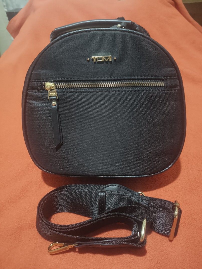 Tumi Mini 3 Way Hand/Sling/Body Bag (Category: Cross-body Bags) located in Quezon City. Submitted by jhaneth21 (Listing ID 1460365132, Image 1). Description: Twice Used Only Gold Hardware 2 Zip Compartments 10/10 Color Rate Tumi Hardware Logo Size: 8.5" x 8" .