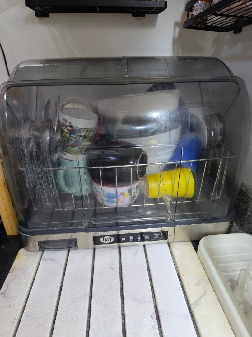 TYLR Hot-Air Dish Dryer (Category: Other Kitchenware & Tableware) located in Muntinlupa City. Submitted by kc_10 (Listing ID 1460447244, Image 2). Description: - TYLR Hot-Air Dish Dryer - Keeps dishes dry and hygienic - Compact design fits most countertops - Easy to use controls - Ideal for small kitchens or apartments Issue: The middle glass is cracked, but was able to put mighty bond. Overall the item is working fine. - Reduces drying time - Pr