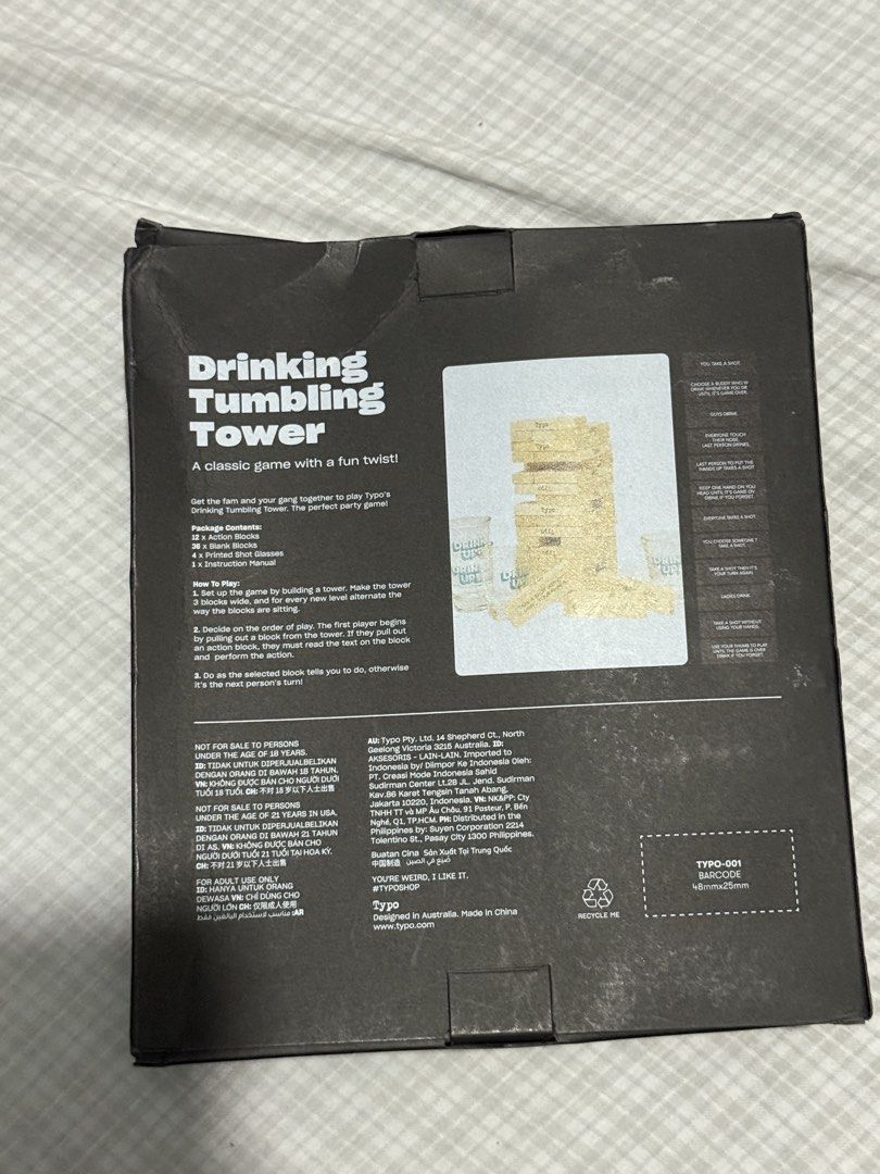Typo Drinking Tumbling Tower (Category: Other Kitchenware & Tableware) located in Iloilo. Submitted by qwertrisha (Listing ID 1460425676, Image 2). Description: - Classic tumbling tower game with a fun drinking twist. - Comes with 4 shot glasses featuring 'DRINK UP' print. - Ideal for parties and gatherings. - Enjoy a fun game night with friends..