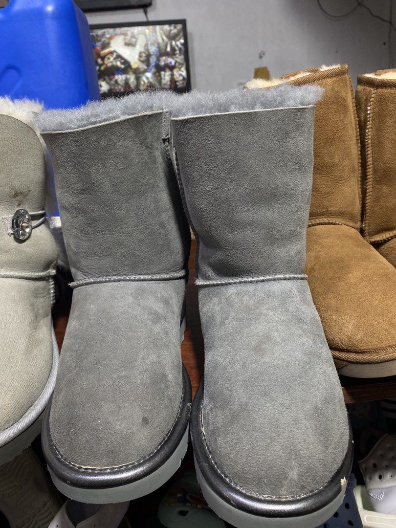 UGG Australia Grey Bow Boots (Category: Boots) located in Baguio. Submitted by workwear2600 (Listing ID 1460395358, Image 2). Description: - Stylish grey UGG boots - Adorable grey bow detail on the back - Mid-calf height - Plush sheepskin lining for warmth and comfort - Durable soles with signature UGG logo pattern - Perfect for staying cozy during colder weather.