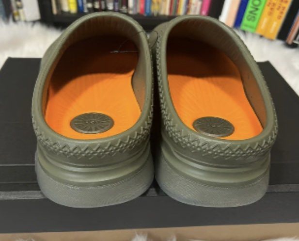 UGG Men's Scuffette II Slipper Clogs Olive Green (Category: Slippers & Slides) located in Baguio. Submitted by workwear2600 (Listing ID 1460485976, Image 3). Description: - Olive green UGG clogs - Easy slip-on style - Perforated for enhanced breathability - Vibrant orange interior lining - Comes with original box - Ideal for casual outings or lounging at home.