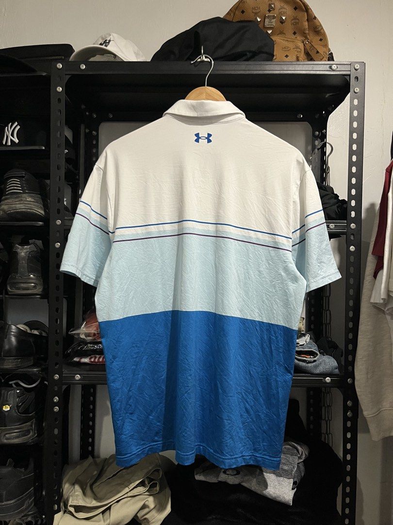 Under Armour - Playoff Polo Shirt (Category: Tshirts & Polo Shirts ) located in Virac. Submitted by _thecave (Listing ID 1460378737, Image 2). Description: Under Armour - Playoff Polo Shirt Good as new 9.8/10 Color Rate No Issue Tagged Size: L Width: 21 Length: 29.