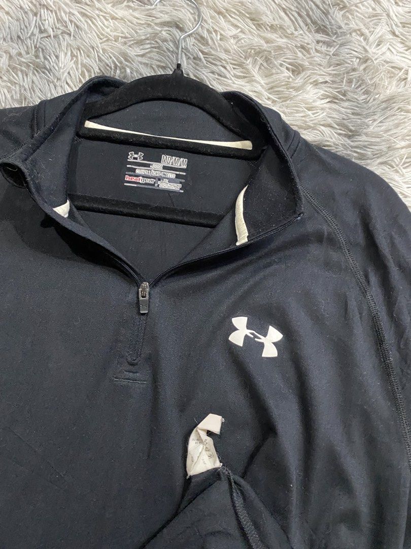 Under armour Qzip Sweater (Category: Coats, Jackets and Outerwear) located in Manila. Submitted by kurtmnla (Listing ID 1460470782, Image 3). Description: Under armour Qzip Sweater Size M fit/ Unisex Dimes 22x28 Good condition/ issue a print got stuck to it. 📍Quezon city.
