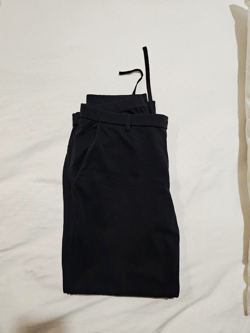 Uniqlo Black Polyester Pants Size M (Category: Trousers) located in Makati City. Submitted by richpaul_ (Listing ID 1460434827, Image 3). Description: - Brand: Uniqlo - Color: Black - Material: 100% Polyester - Size: M (fits waist 76-84cm) - Features: Drawstring waist, Straight leg cut - Style: Versatile for casual or smart casual outfits, easy to pair with any top..