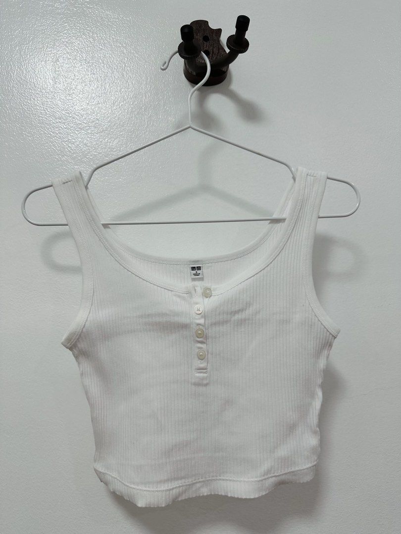 Uniqlo Button Down White Tank Top (Category: Sleeveless) located in Paranaque City. Submitted by kokoclosets (Listing ID 1460494104, Image 1). Description: Still good as new! One of my fave basic tops to wear in college😆.