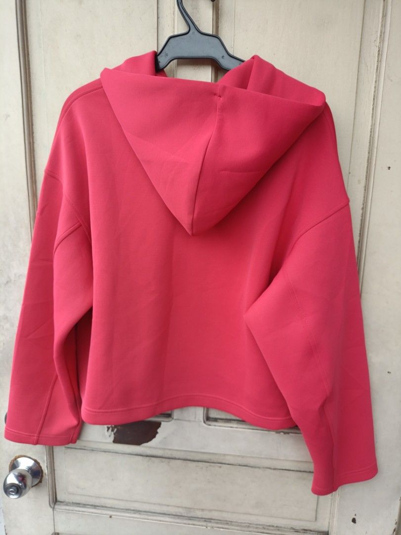UNIQLO DRY HOODIE (Category: Coats, Jackets and Outerwear) located in Quezon City. Submitted by collectandselect (Listing ID 1460416366, Image 3). Description: - Red Uniqlo hoodie - Size: L - Made in China - Features DRY technology (quick-drying) - Cropped style - Adjustable drawstrings on hood - Ideal for casual wear.