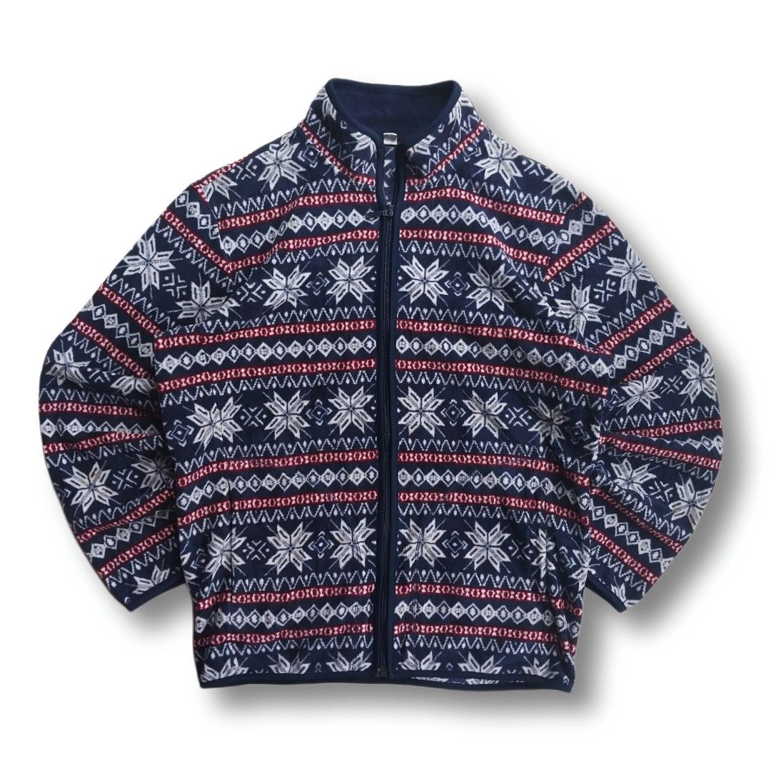 Uniqlo Snowflake Fleece Zip-Up Jacket (Category: Coats, Jackets and Outerwear) located in Cavite. Submitted by spinfits (Listing ID 1460341865, Image 1). Description: - Cozy navy blue fleece jacket - Features a fun white and red snowflake and geometric pattern - Full zip-up front with a stand-up collar - Ideal for layering in colder weather - Soft, warm, and perfect for the BERMONTHS Size: S-M (Width: 22") (Lenght: 27") INCHES Condition: (Lightly