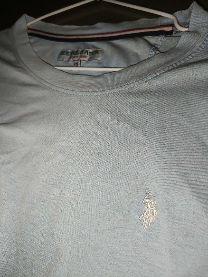 U.S. Polo Assn. Basic Tee — Light Blue (Category: Tshirts & Polo Shirts ) located in Manila. Submitted by ramlouie_thriftshop (Listing ID 1460430500, Image 2). Description: Authentic U.S. Polo Assn. crew‑neck tee. Soft light sky‑blue fabric, subtle embroidered pony logo — simple, clean, versatile. Great for daily casual outfits. Size 2XL / 44. Good used condition — no damage, still neat & comfy..