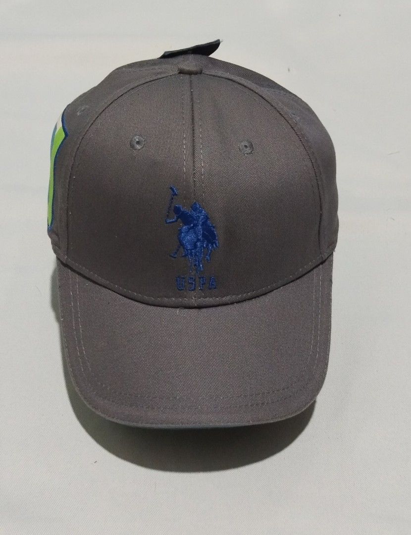 U.S. Polo Assn. Grey Baseball Cap with Number 3 Patch (Category: Caps & Hats) located in Manila. Submitted by wanchi0624 (Listing ID 1460359234, Image 1). Description: - Brand: U.S. Polo Assn. - Color: Grey - Design: Classic polo player logo embroidered in blue on the front. - Accent: Side patch with blue number '3' on green/white background. - Material: 100% Cotton - Condition: Brand new with tags attached..