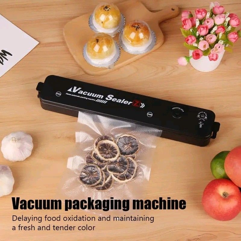 Vacuum Sealer Z Home Automatic Packing Machine (Category: Other Home Appliances) located in Manila. Submitted by marvieobordo (Listing ID 1460446699, Image 3). Description: - Keep food fresh longer with this powerful vacuum sealer. - Vortex whirlwind large suction for increased power. - 3mm sealing width ensures an airtight seal. - 30cm heating wire for stable and reliable performance. - Effectively delays food oxidation and maintains freshness. 