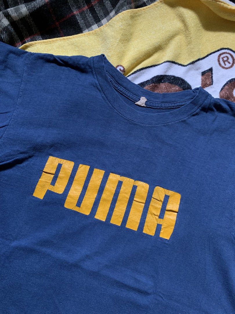 Vintage 1970s Puma x Beconta tee (Category: Tshirts & Polo Shirts ) located in Cagayan de Oro. Submitted by premium_thrifts (Listing ID 1460315787, Image 2). Description: Navy blue colorway. Good condition. Issue: crackprint - MEASUREMENTS: L26.8" x W19" 17" (shoulder to shoulder) 6.7" (sleeve length) Fits Medium Add shipping fee (via JRS or J&T).