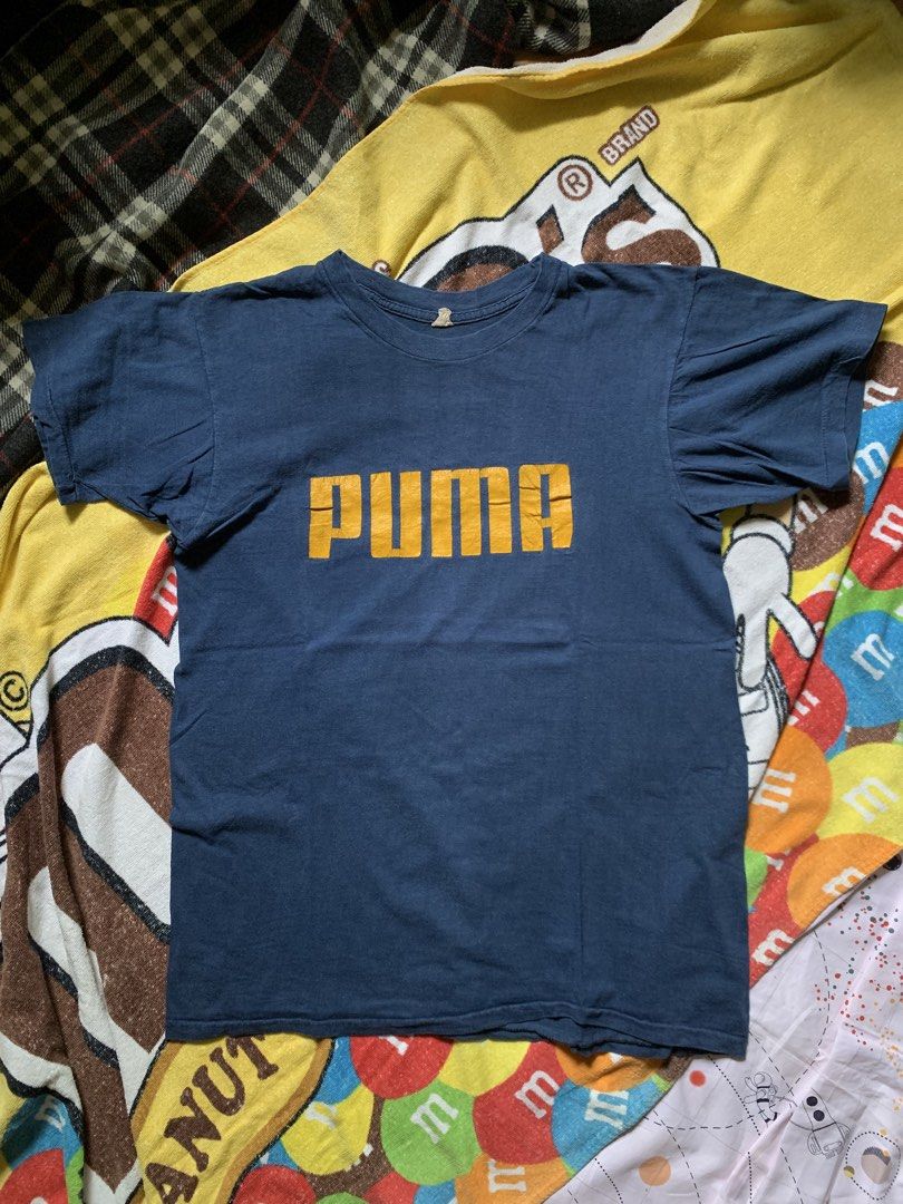 Vintage 1970s Puma x Beconta tee (Category: Tshirts & Polo Shirts ) located in Cagayan de Oro. Submitted by premium_thrifts (Listing ID 1460315787, Image 1). Description: Navy blue colorway. Good condition. Issue: crackprint - MEASUREMENTS: L26.8" x W19" 17" (shoulder to shoulder) 6.7" (sleeve length) Fits Medium Add shipping fee (via JRS or J&T).