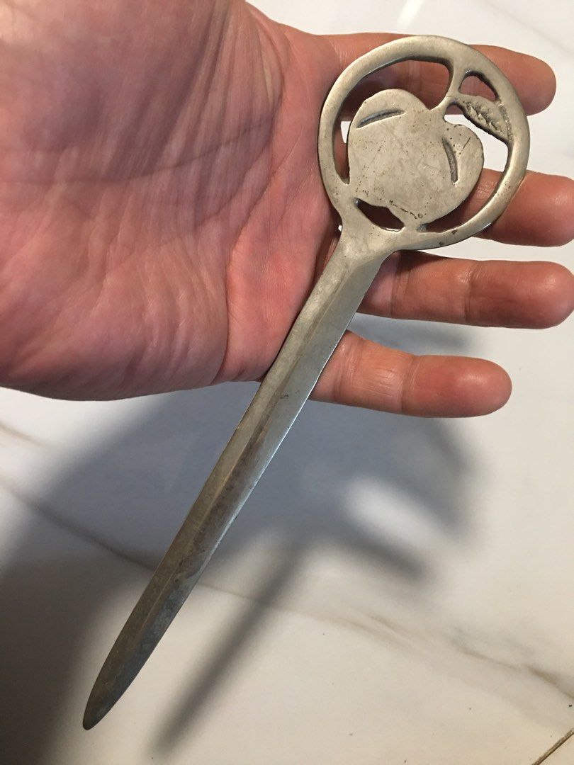 Vintage Apple Design Letter Opener (Category: Vintage Collectibles) located in Pasay City. Submitted by gilbertso62551 (Listing ID 1460472219, Image 3). Description: - Cool vintage letter opener - Features a circular design with an apple motif - Metal has a nice patina from age - Great for opening mail or as a desk accessory - Unique piece for collectors - As is,where is.