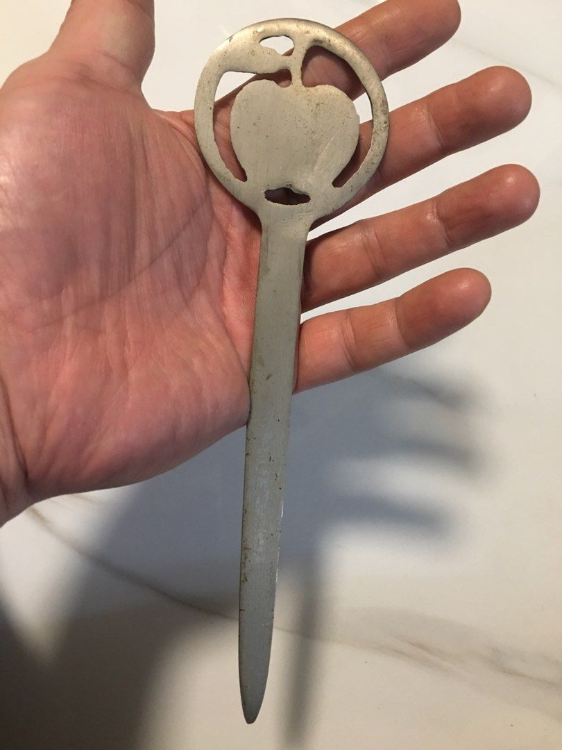 Vintage Apple Design Letter Opener (Category: Vintage Collectibles) located in Pasay City. Submitted by gilbertso62551 (Listing ID 1460472219, Image 2). Description: - Cool vintage letter opener - Features a circular design with an apple motif - Metal has a nice patina from age - Great for opening mail or as a desk accessory - Unique piece for collectors - As is,where is.