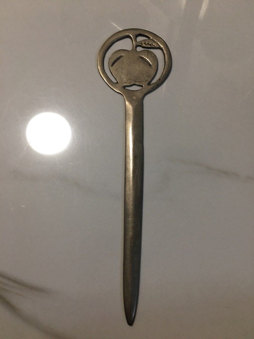 Vintage Apple Design Letter Opener (Category: Vintage Collectibles) located in Pasay City. Submitted by gilbertso62551 (Listing ID 1460472219, Image 1). Description: - Cool vintage letter opener - Features a circular design with an apple motif - Metal has a nice patina from age - Great for opening mail or as a desk accessory - Unique piece for collectors - As is,where is.