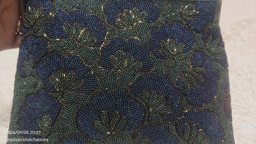 VINTAGE BEADED PARTY BAG (Category: Purses & Pouches) located in Kalibo. Submitted by secondchances.thriftsh8p (Listing ID 1460450046, Image 3). Description: - Beautiful beaded handbag - Dark blue and green floral pattern - Black handle and frame - Secure clasp closure at the top - Ideal for parties and special occasions - Unique vintage piece.