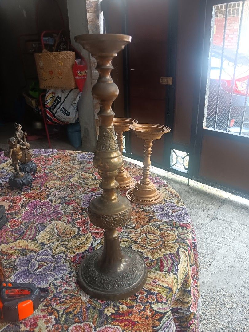 Vintage Brass Candlesticks Set - Ornate Design (Category: Other Home Decor) located in Las Pinas. Submitted by jesus1smysavi0r (Listing ID 1460375365, Image 1). Description: - Set of 3 vintage brass candlesticks - Features ornate detailing and classic design - One candlestick marked 'RUBEL 1968 M.C.B.O.S.' - Perfect for home decor or special occasions - Beautiful patina from age.
