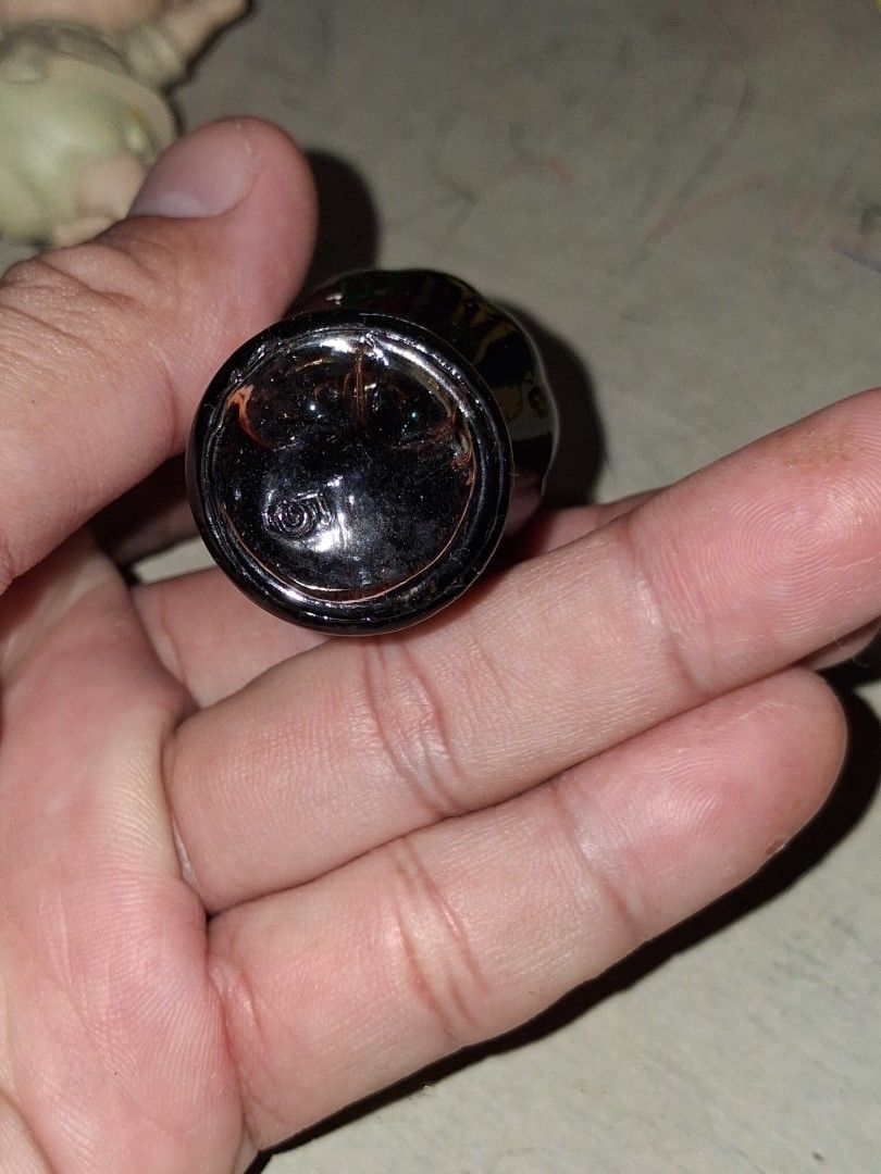 Vintage Miniature Coca-Cola Bottle with Liquid (Category: Vintage Collectibles) located in Manila. Submitted by marcas022798212 (Listing ID 1460440054, Image 3). Description: Small glass bottle shaped like a classic Coca-Cola bottle. It has the Coca-Cola logo embossed on the side. There's some dark liquid still inside. Great for collectors or as a tiny display piece. Measures about 2 inches long..